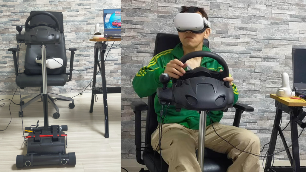 VR運転環境とハンドルコントローラを使ってVRで自動車を運転している様子